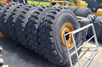 Bridgestone 6X 16.00 - 24 tires on Cat rim / 90% thread / Cat 14H